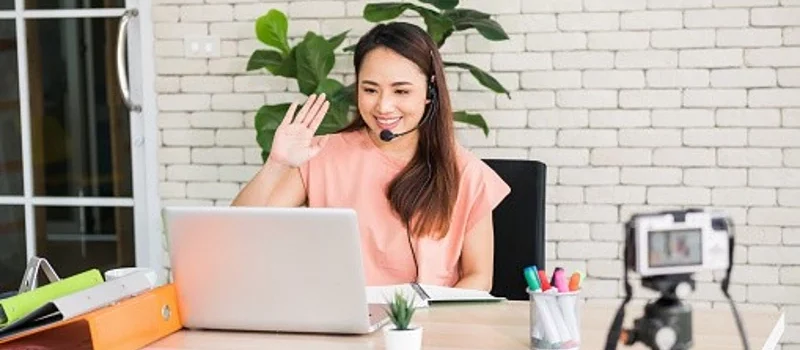 Home-Based-Jobs-Philippines-professional-attending-a-video-call-from-a-home-office